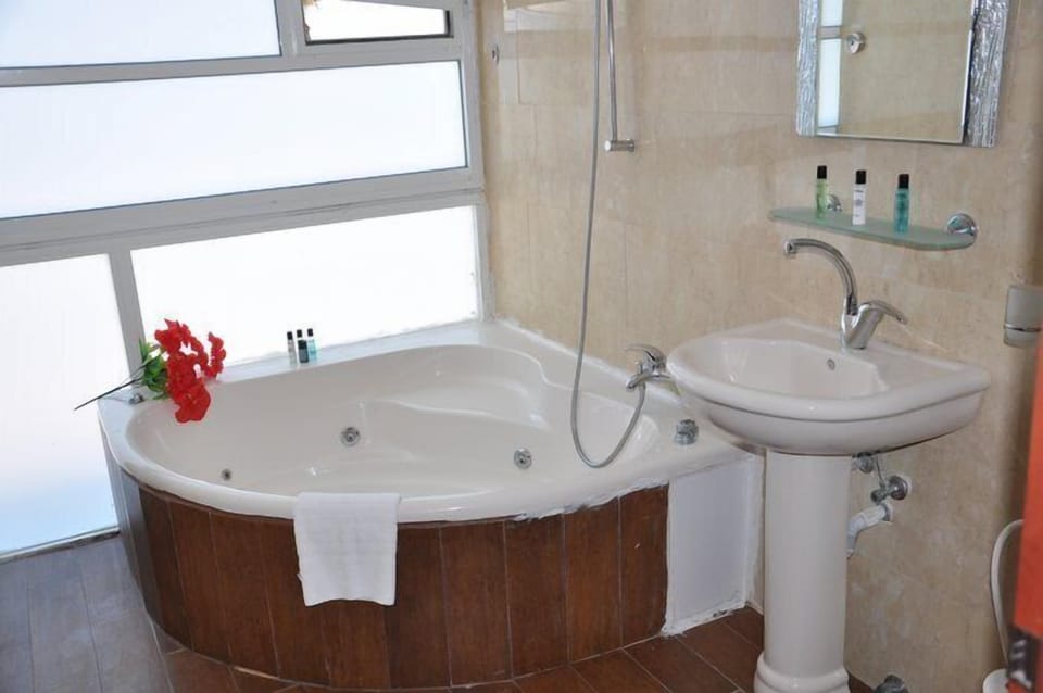 Shower, free toiletries, hair dryer, slippers