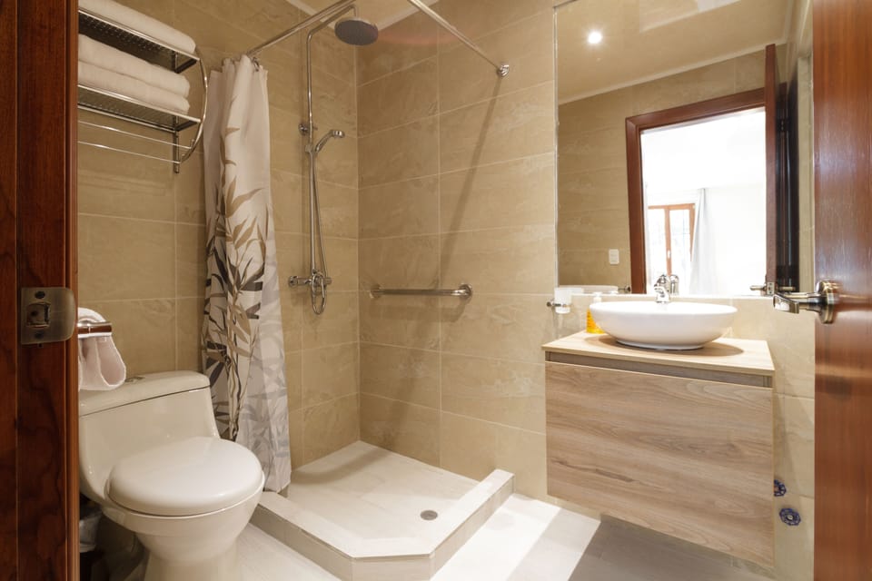 Room, 2 Queen Beds | Bathroom | Combined shower/tub, hair dryer, towels