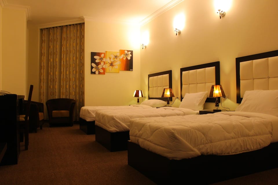 Triple Room, City View | Premium bedding, minibar, in-room safe, desk