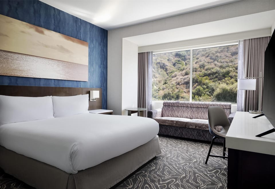Suite, 1 King Bed with Sofa bed, Non Smoking | Pillowtop beds, in-room safe, desk, laptop workspace