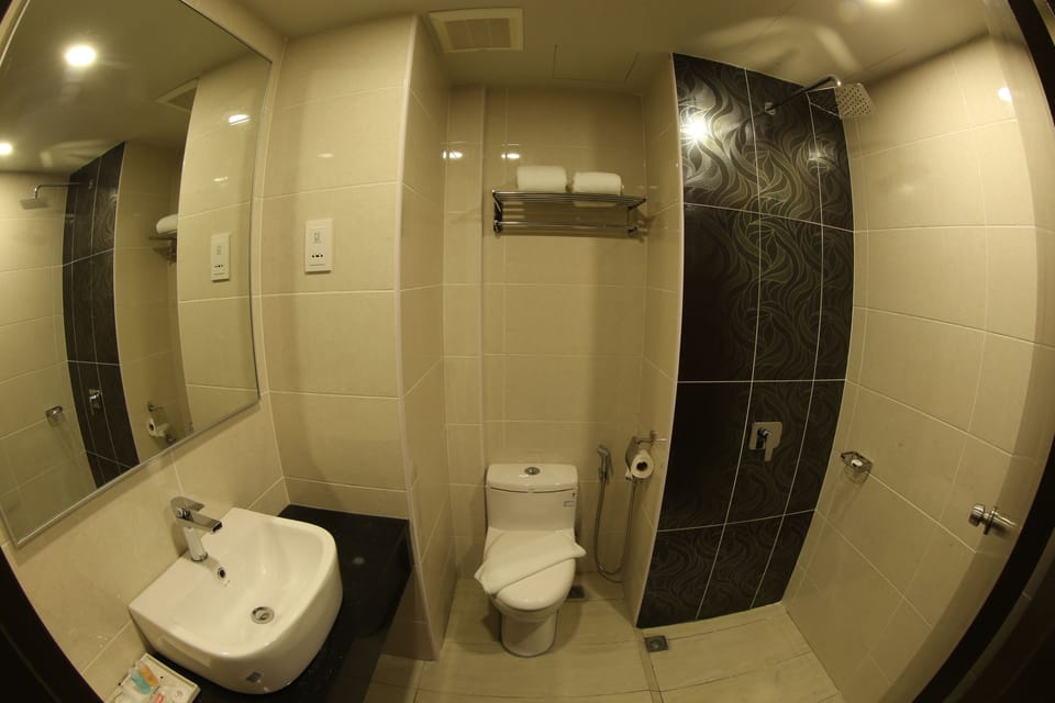 Shower, free toiletries, hair dryer, slippers