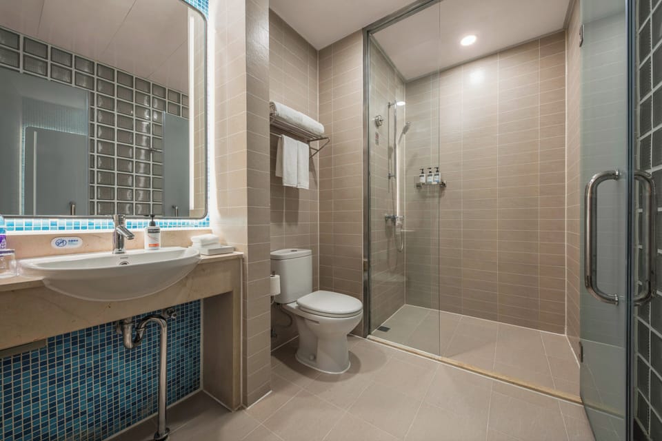 Standard Room, 1 Queen Bed (Exercise Equipment) | Bathroom | Shower, free toiletries, hair dryer, slippers