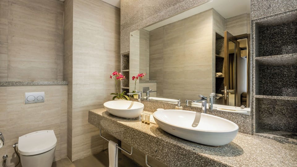 The Wujil Suite | Bathroom | Shower, hair dryer, slippers, towels