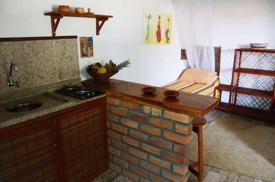 Studio (Triplo) | Private kitchen | Mini-fridge, stovetop, cookware/dishes/utensils, kitchen islands