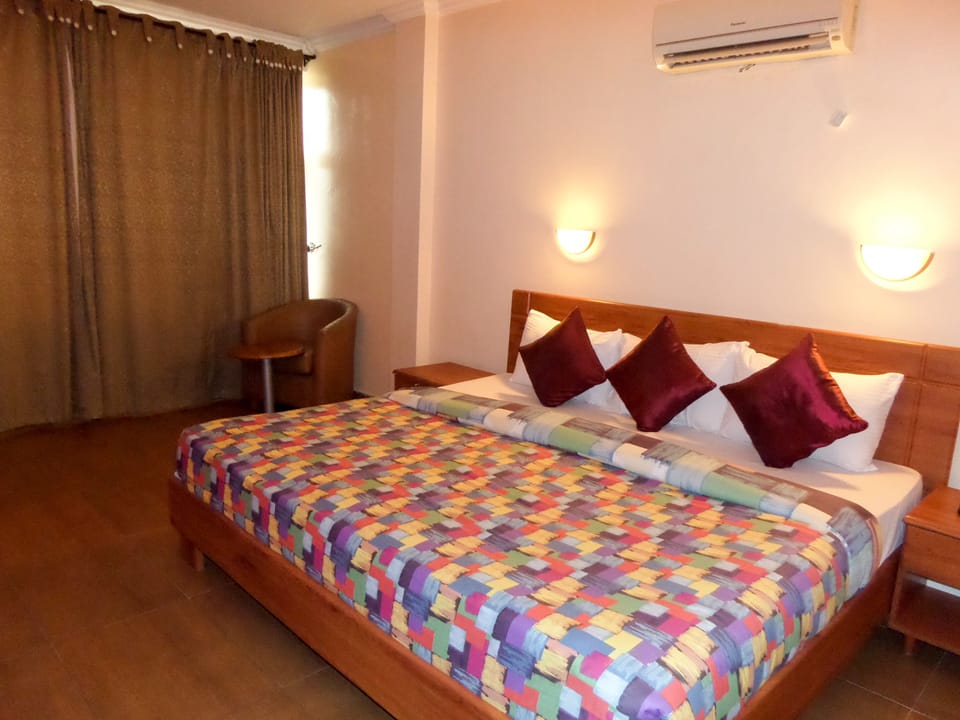 Divas Room | Premium bedding, desk, laptop workspace, blackout drapes