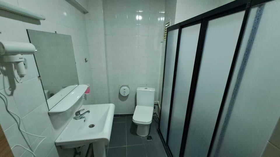 Shower, free toiletries, hair dryer, slippers