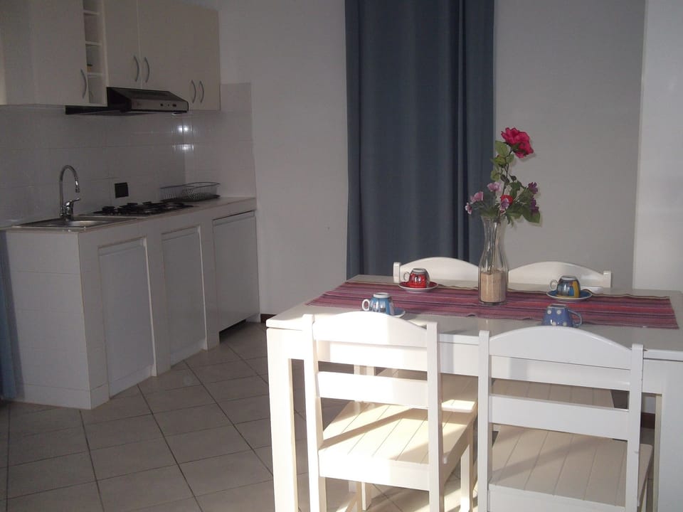 Apartment, 1 Bedroom, Oceanfront | Private kitchen | Coffee/tea maker, full-size fridge, oven, stovetop