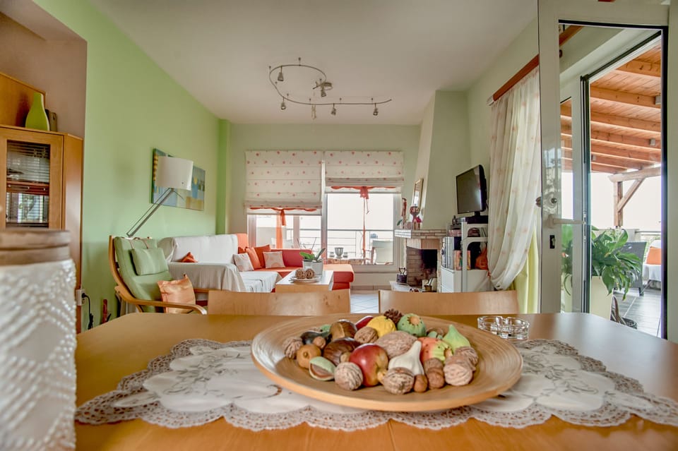 Deluxe Room, 3 Bedrooms | Living area | Flat-screen TV