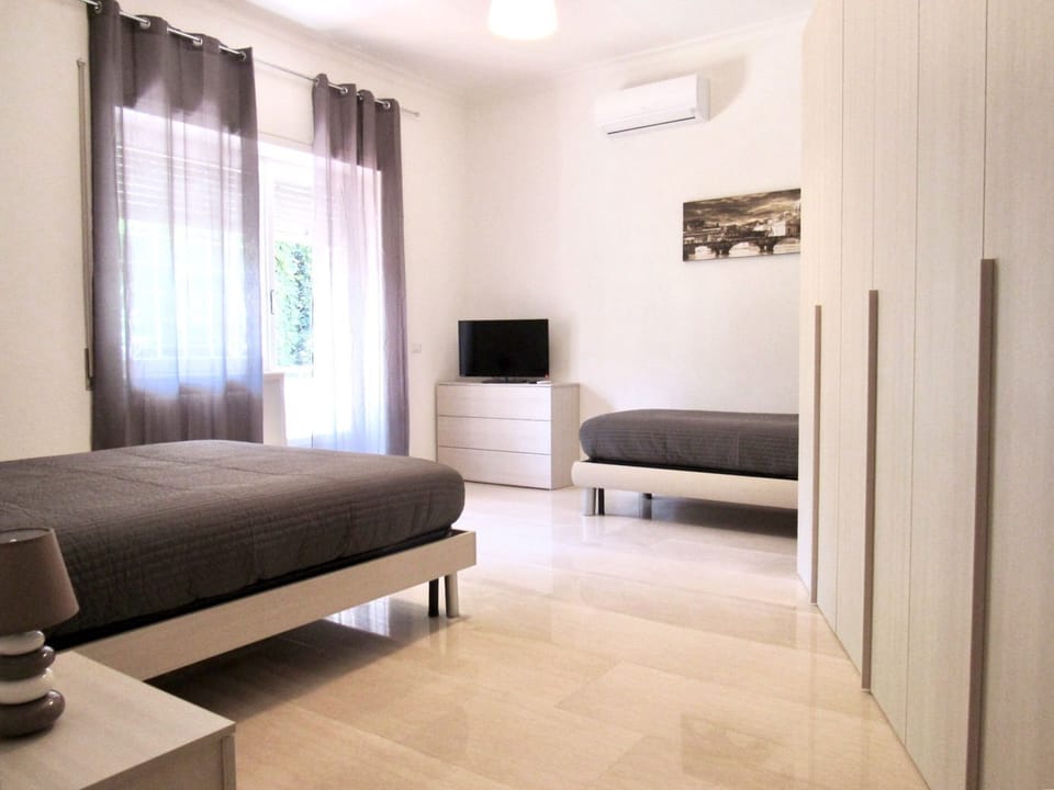 Triple Room, Balcony | Down comforters, blackout drapes, free WiFi, bed sheets