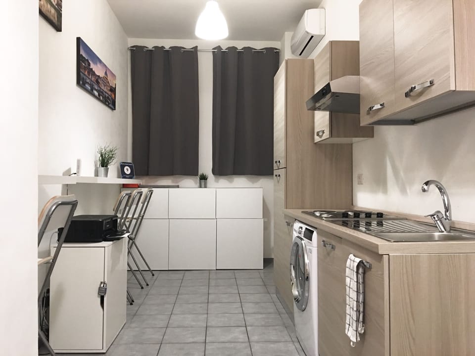 Full-size fridge, stovetop, cookware/dishes/utensils, cleaning supplies