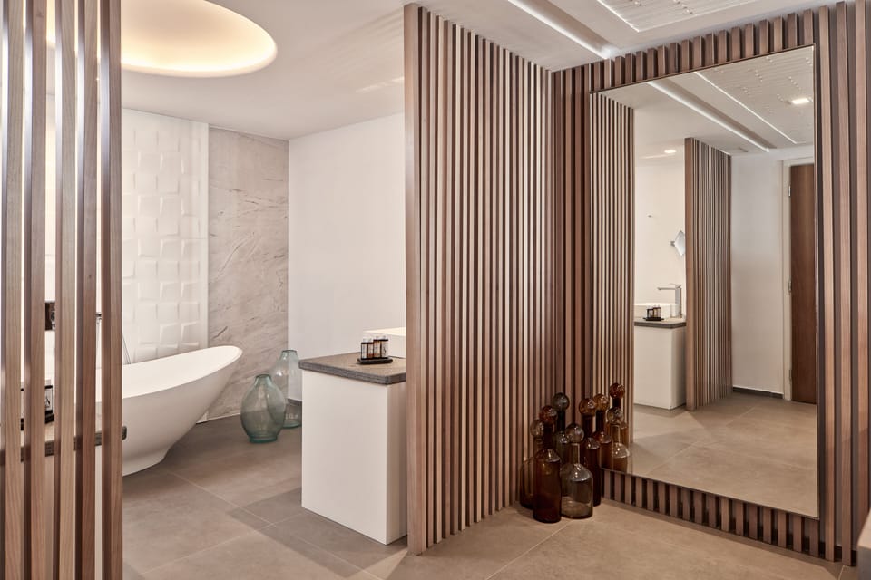 Junior Suite, Sea View (Outdoor Spa Jetted Tub, Delos) | Bathroom | Designer toiletries, hair dryer, slippers, towels