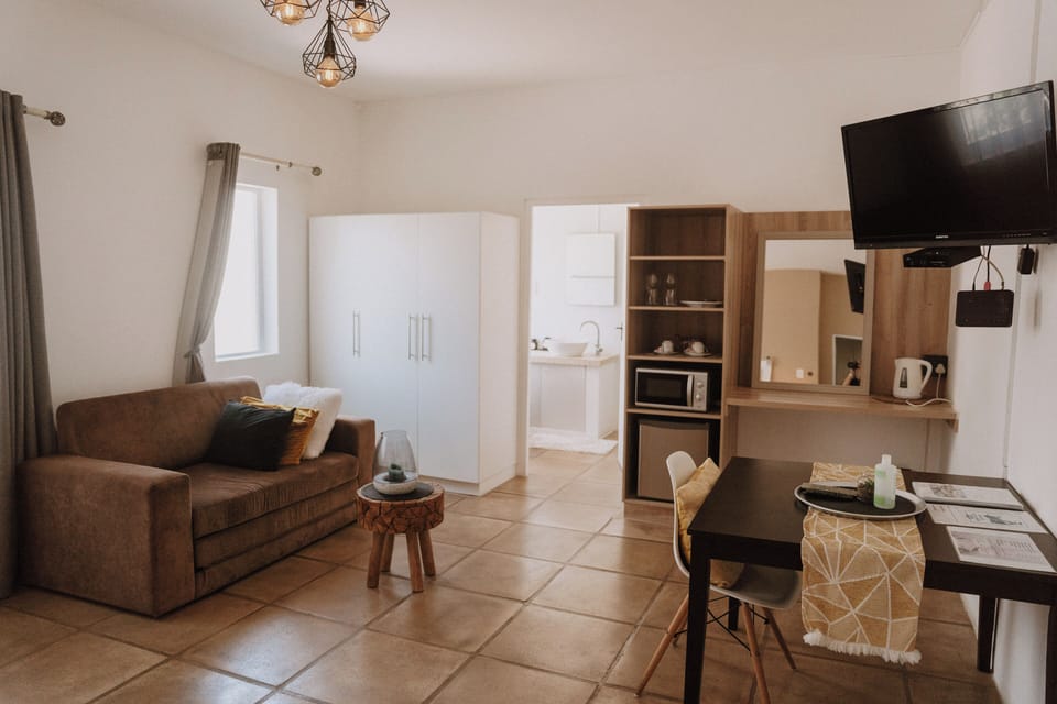 Family Room, 1 Bedroom (Family Room - Sandstorm) | Living area | Flat-screen TV