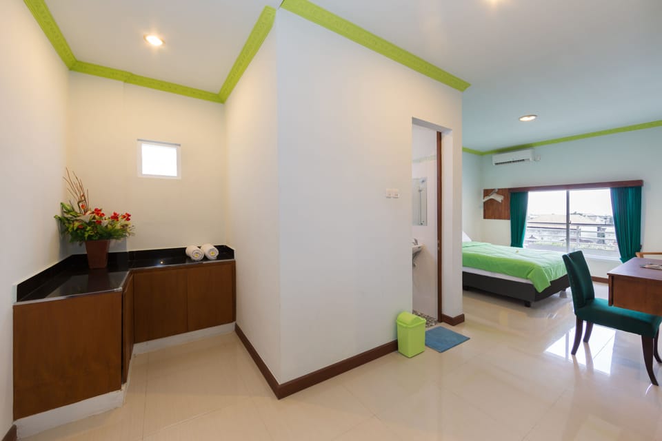 Deluxe Room, 1 Double Bed, Garden View | Desk, blackout drapes, iron/ironing board, cribs/infant beds