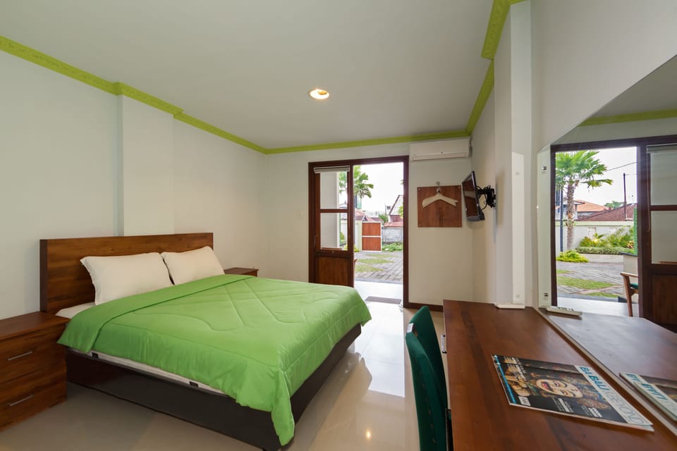Deluxe Room, 1 Double Bed, Garden View | Desk, blackout drapes, iron/ironing board, cribs/infant beds