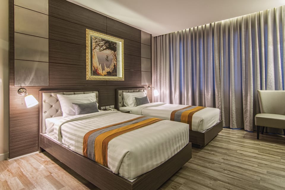 Superior Room, 2 Twin Beds, Non Smoking, Private Bathroom | Free minibar items, in-room safe, individually decorated, desk