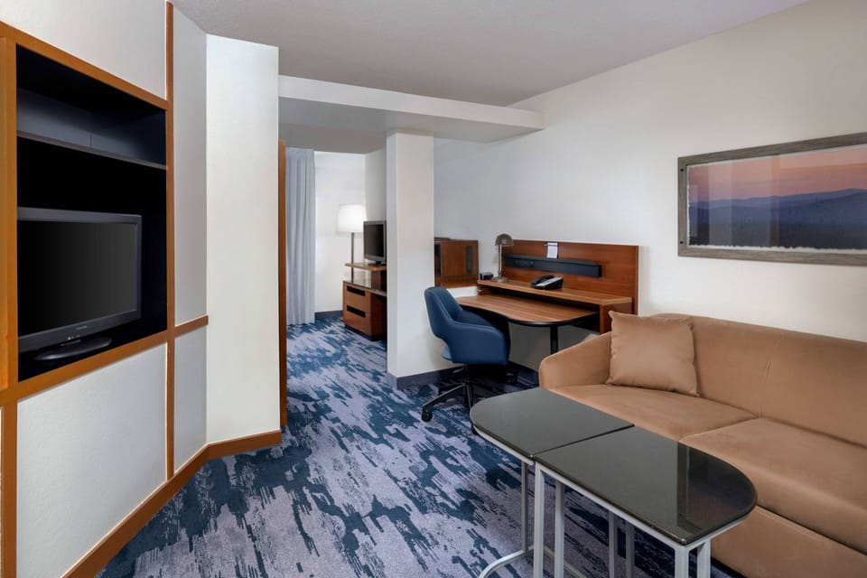 Suite, 1 King Bed with Sofa bed | Living area | 32-inch flat-screen TV with cable channels, TV