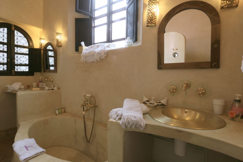 Superior Suite, Multiple Beds, Private Bathroom | Bathroom | Designer toiletries, hair dryer, slippers, towels
