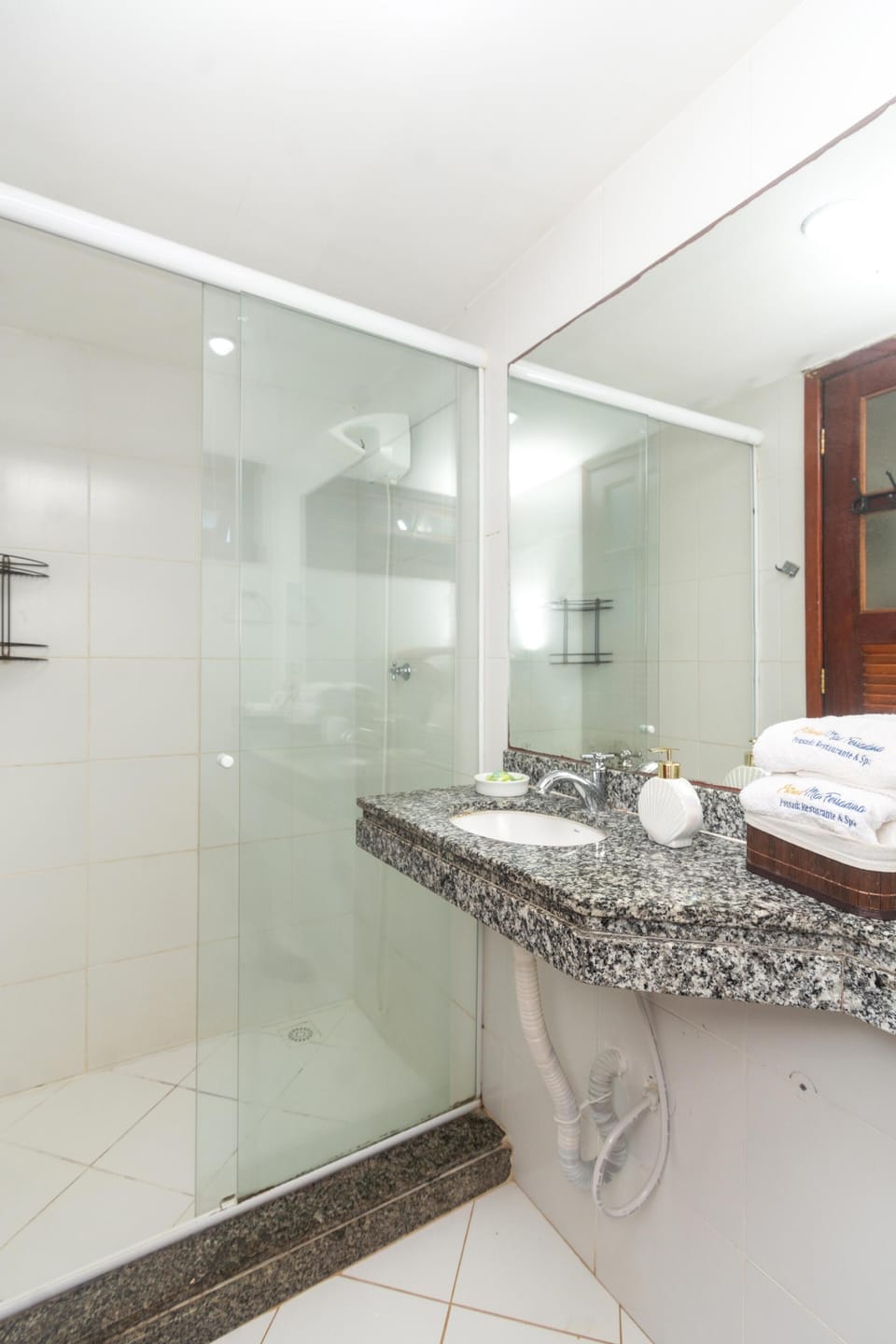 Shower, rainfall showerhead, hair dryer, towels
