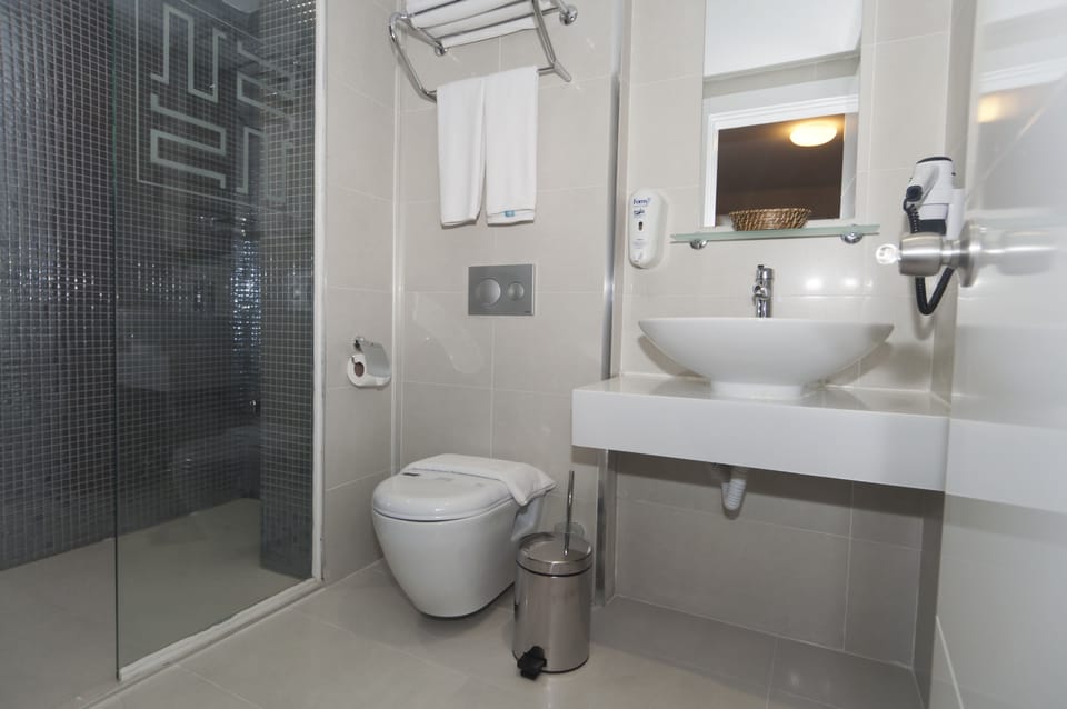 Shower, free toiletries, hair dryer, slippers