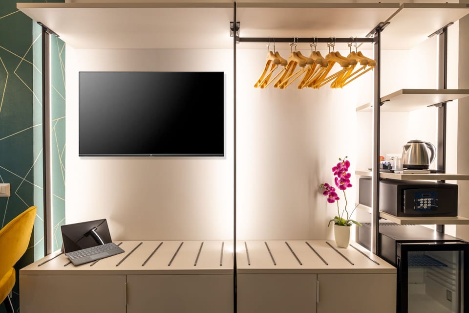 Family Room | Down comforters, minibar, in-room safe, desk