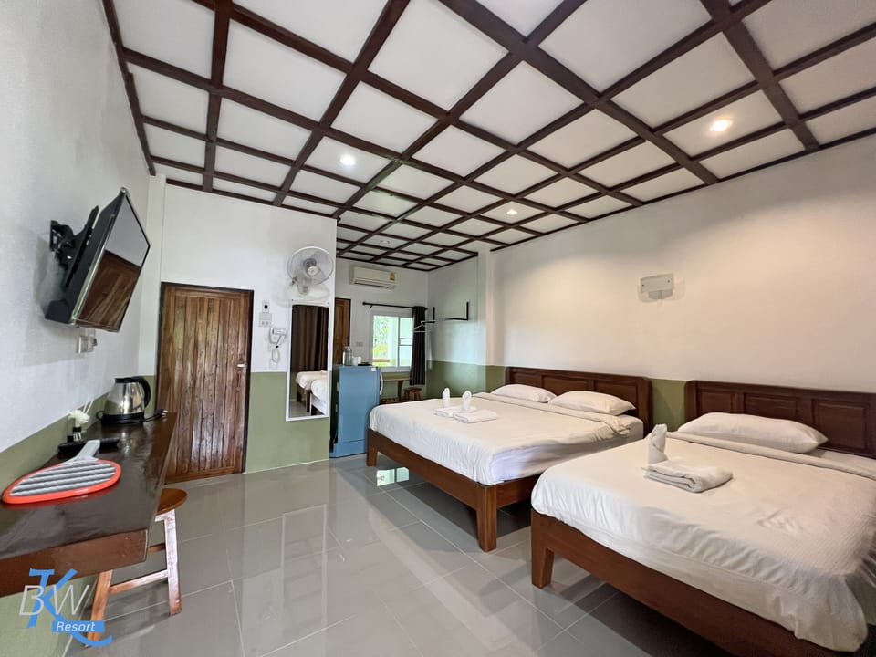 Triple Room | Desk, blackout drapes, WiFi (free), bed sheets