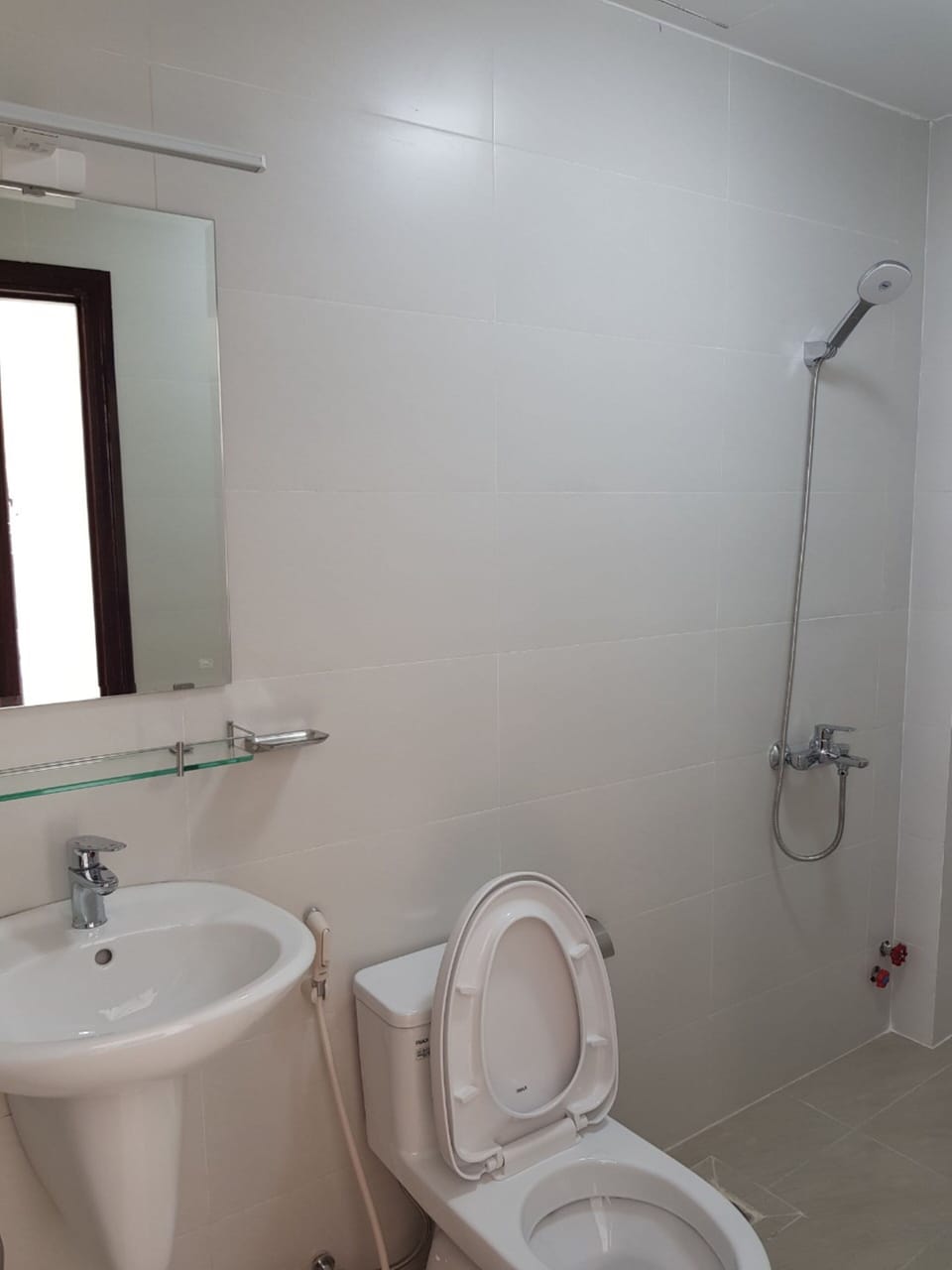 Shower, slippers, bidet, towels