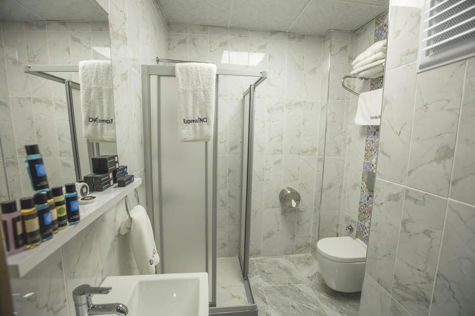 Premium bedding, free minibar items, in-room safe, desk