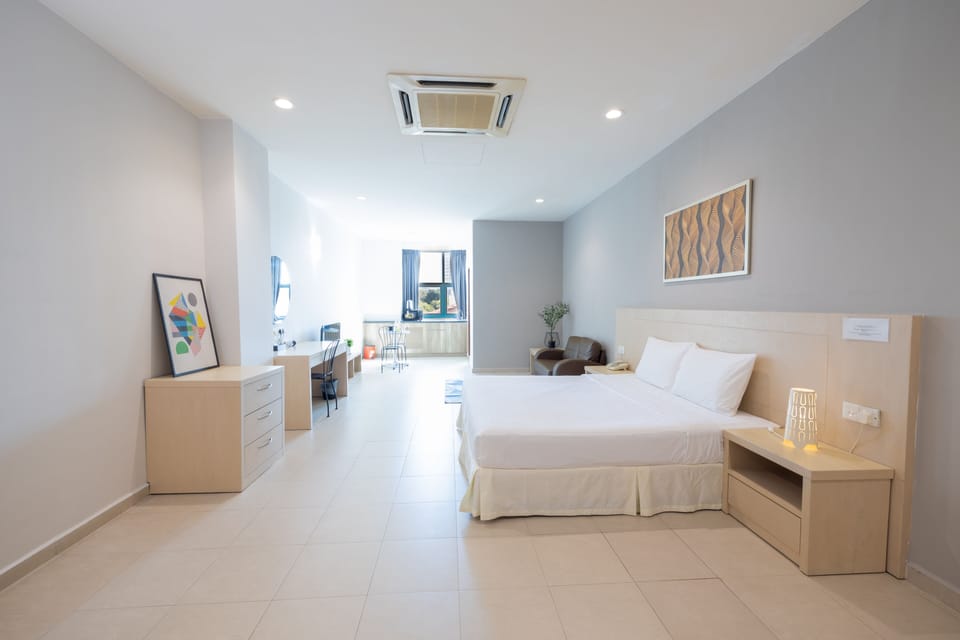 Superior King with Kitchenette | Desk, blackout drapes, iron/ironing board, free WiFi