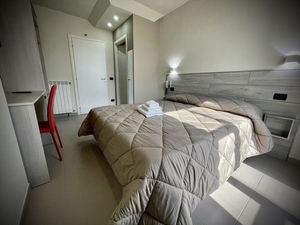 Premium bedding, down comforters, desk, laptop workspace