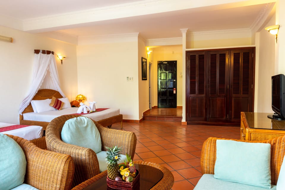 Triple Room, Pool View | Premium bedding, minibar, in-room safe, rollaway beds