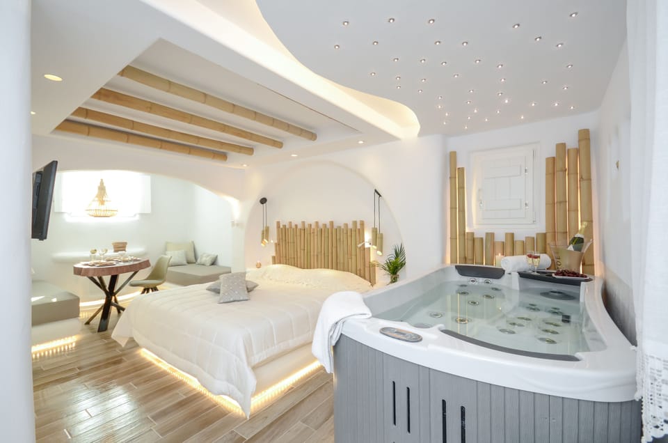 Suite, Jetted Tub (Sunken) | Premium bedding, pillowtop beds, in-room safe, individually decorated
