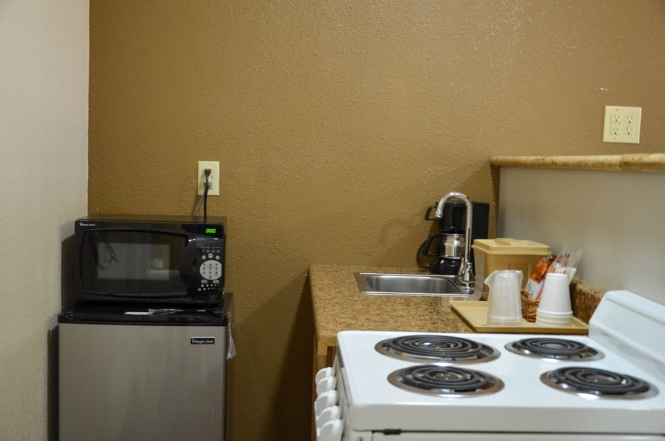 Deluxe Room, Multiple Beds, Non Smoking | Private kitchen | Fridge, microwave, coffee/tea maker
