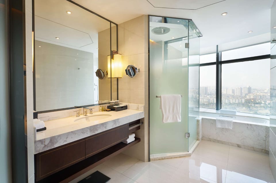Executive Room, 1 King Bed | Bathroom | Separate tub and shower, free toiletries, hair dryer, bathrobes