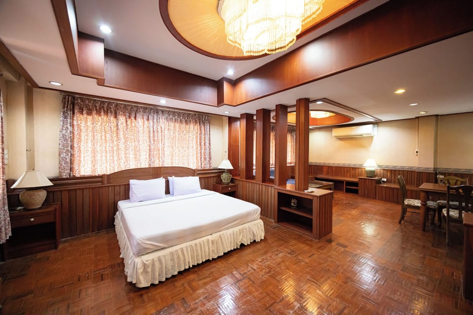 Signature Suite | Desk, laptop workspace, blackout drapes