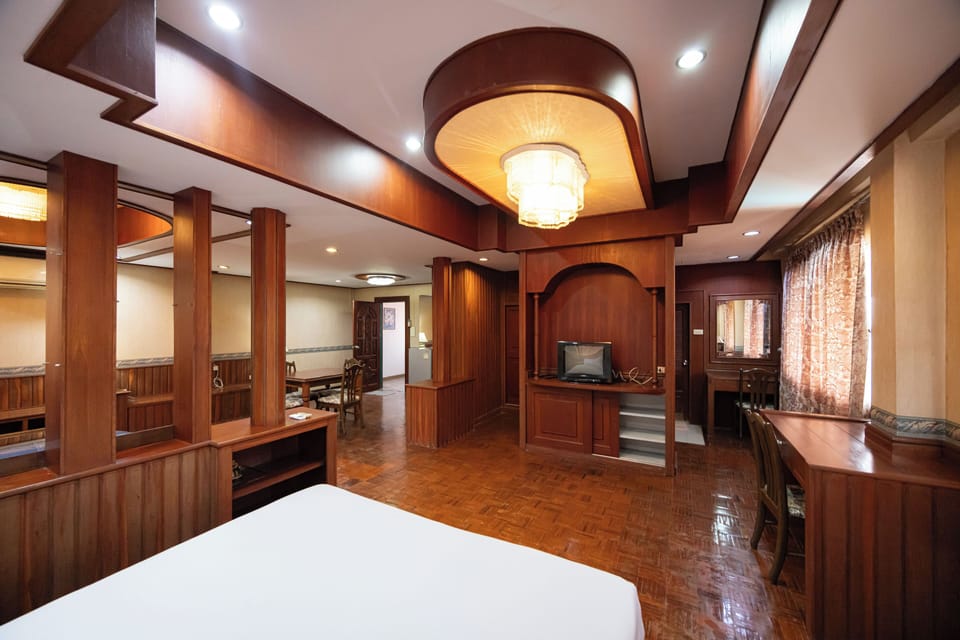 Signature Suite | Desk, laptop workspace, blackout drapes