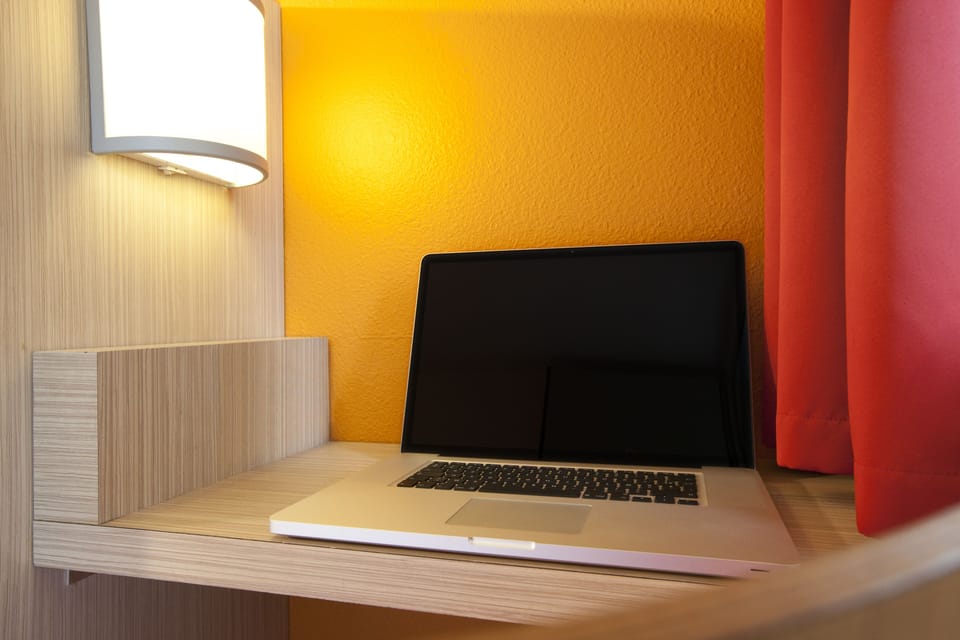 Desk, blackout drapes, soundproofing, free WiFi