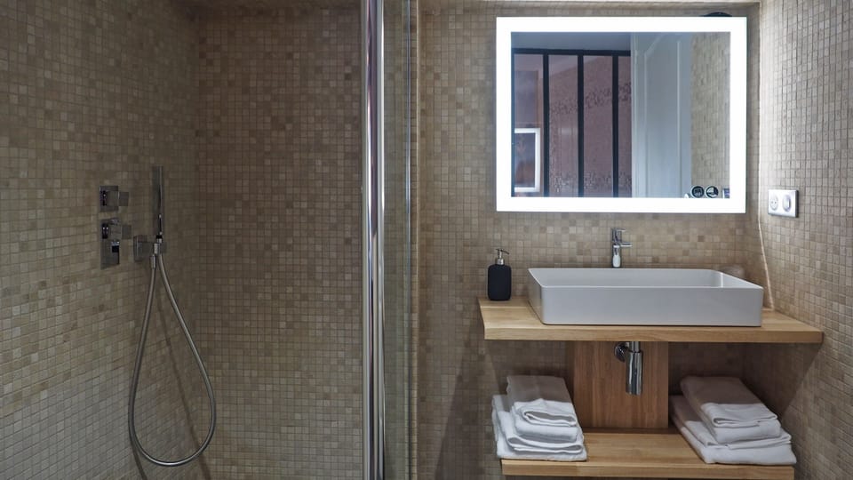 Suite, 1 King Bed, Terrace (Prestige) | Bathroom | Shower, rainfall showerhead, free toiletries, hair dryer