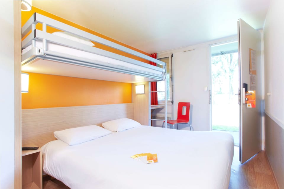Standard Room, Multiple Beds (1 Double and 1 Single bed) | Desk, blackout drapes, iron/ironing board, free cribs/infant beds