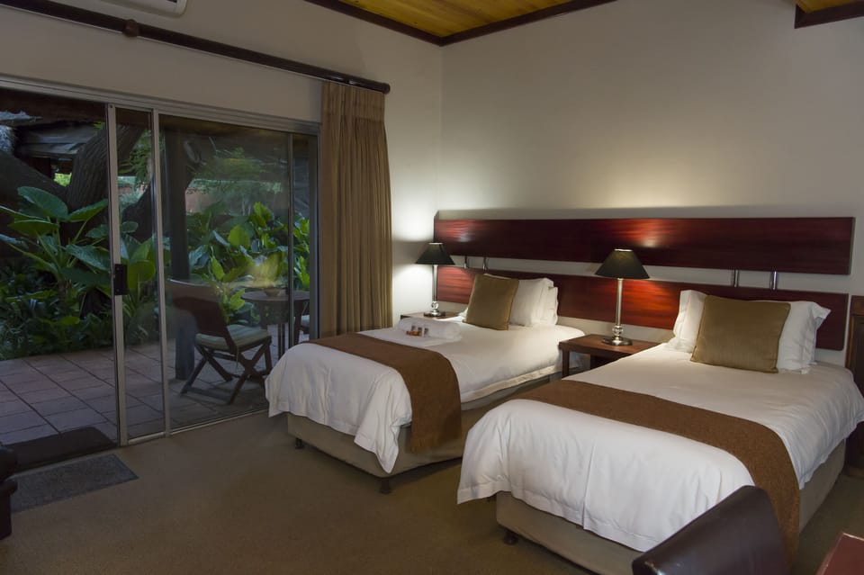 Standard Room, 1 Bedroom (Rm 11, Twin beds/king bed, garden acc) | Minibar, in-room safe, desk, iron/ironing board (on request)
