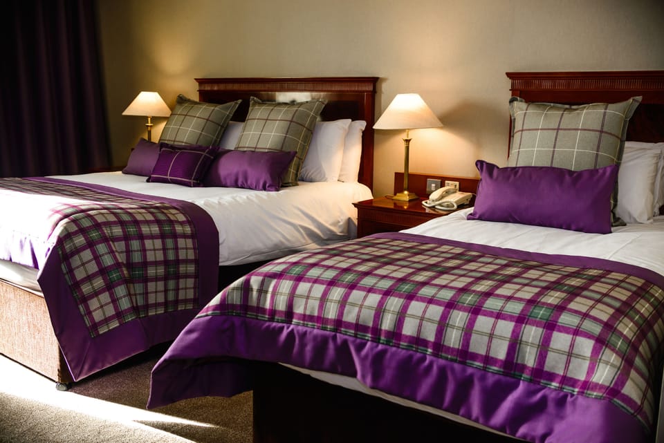 Deluxe Double Room, Multiple Beds | In-room safe, desk, iron/ironing board, free WiFi