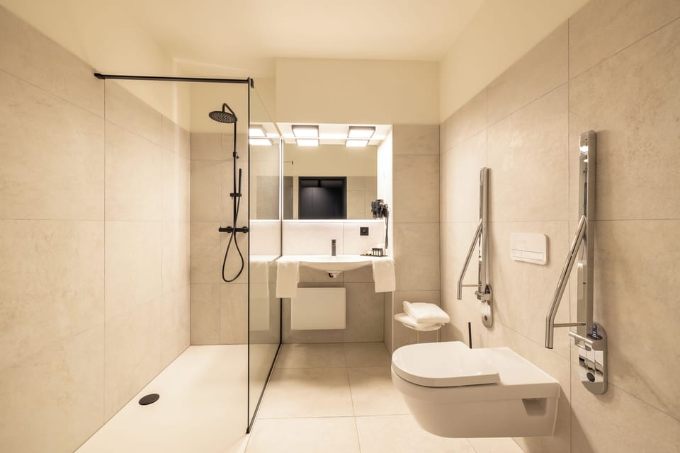 Twin Room | Bathroom | Combined shower/tub, hair dryer (on request), towels, soap