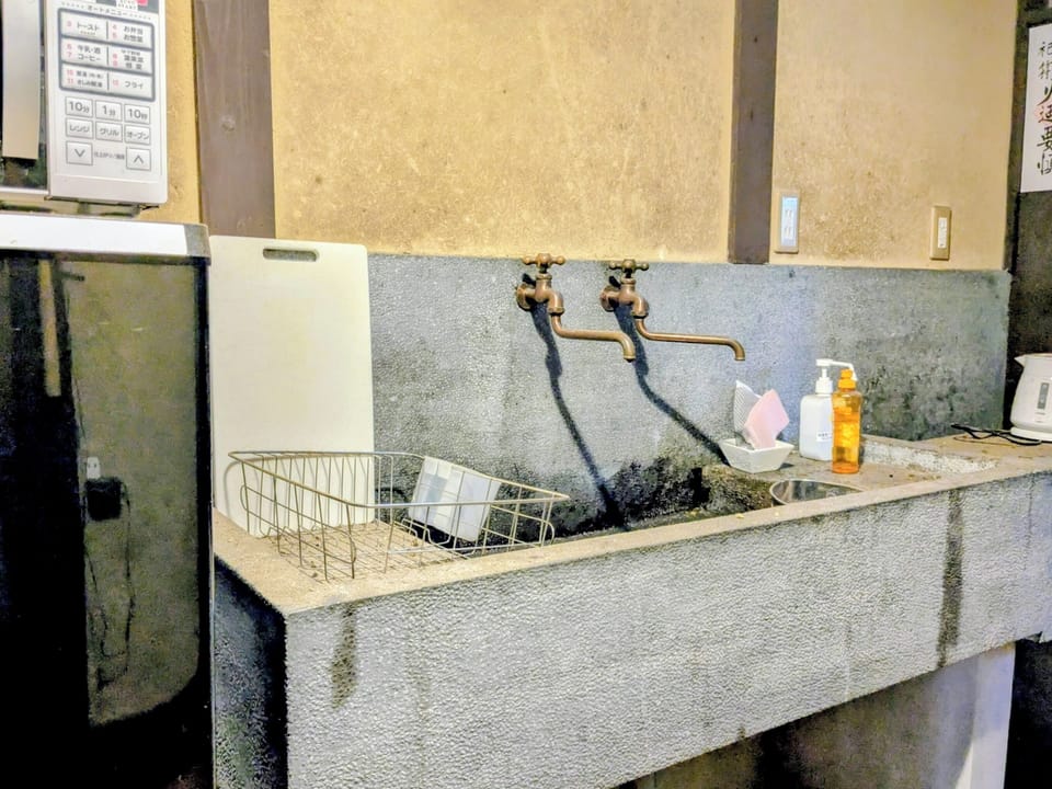 Japanese Style Townhouse | Private kitchen | Full-size fridge, microwave, stovetop, electric kettle