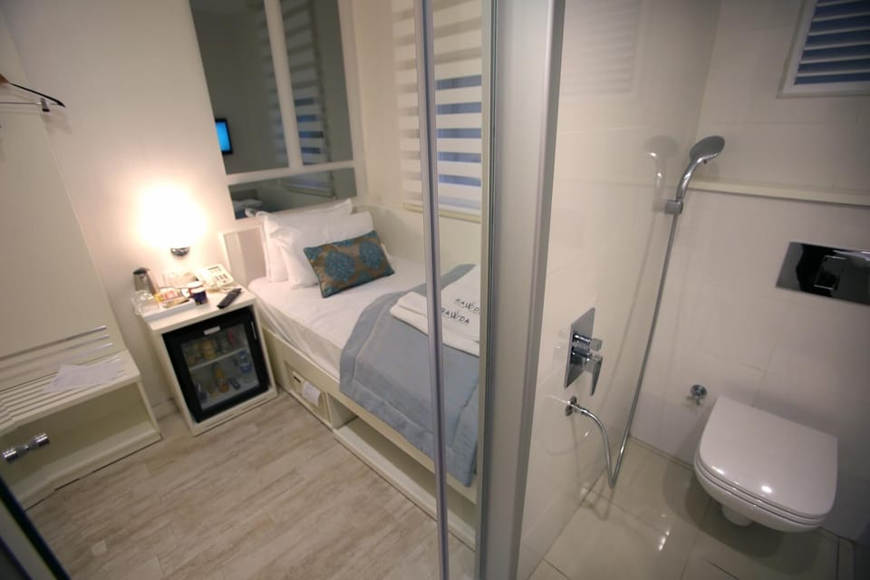 Economy Single Room, No Windows | Minibar, in-room safe, soundproofing, iron/ironing board