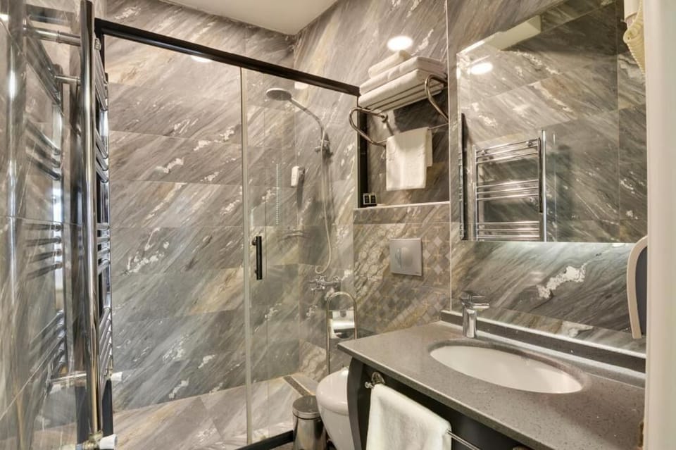 Shower, hair dryer, slippers, towels