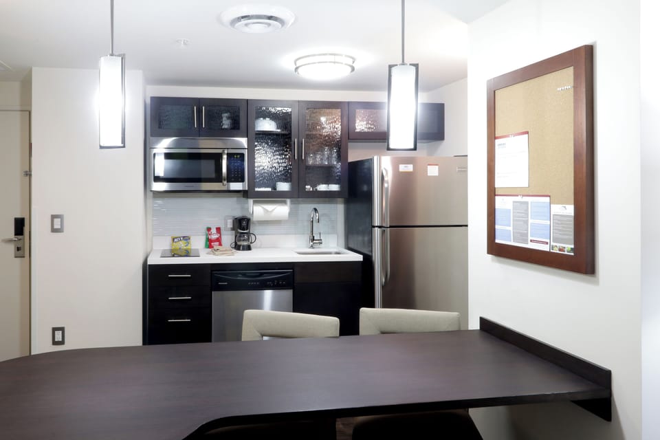 Suite, 1 King Bed | Private kitchen | Full-size fridge, microwave, oven, stovetop