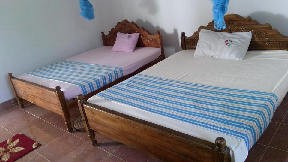 Basic Quadruple Room, 2 Double Beds, Lake View | Premium bedding, desk, iron/ironing board, free WiFi