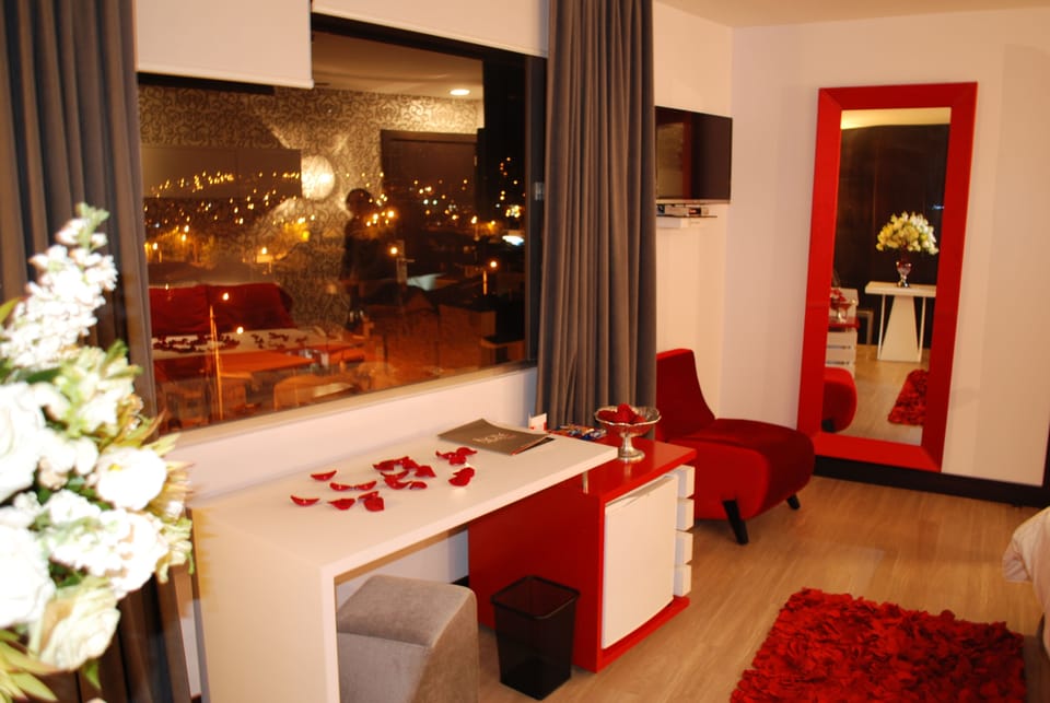 Suite, 1 King Bed, Hot Tub, City View | Premium bedding, minibar, in-room safe, blackout drapes