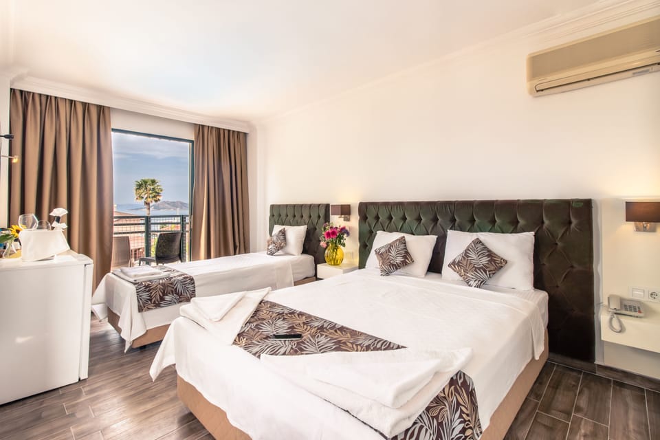 Family Room, Pool View | Minibar, in-room safe, iron/ironing board, free WiFi