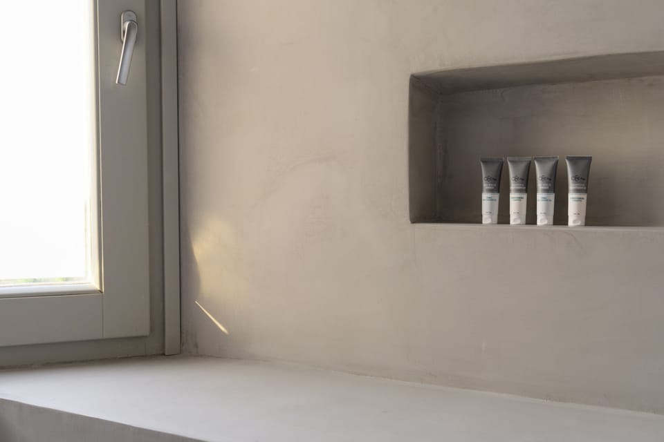 Shower, designer toiletries, hair dryer, bathrobes