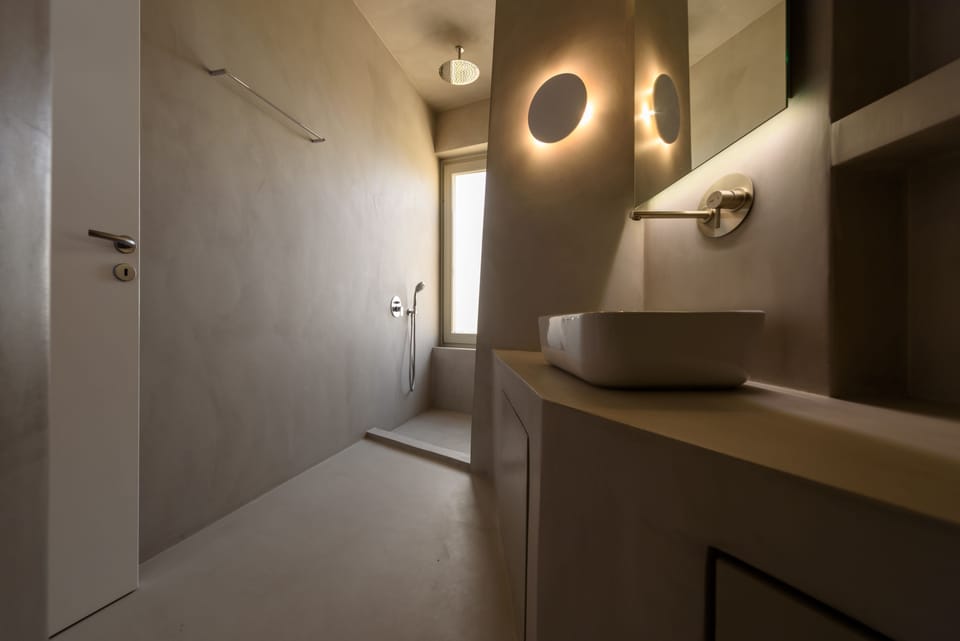 Shower, designer toiletries, hair dryer, bathrobes